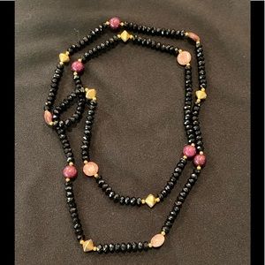 Very reflective gorgeous black necklace with semi precious stones.